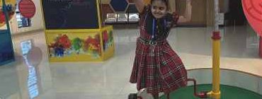 Student with interactive science display