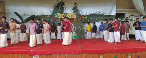 Boys performing Onam dance on stage