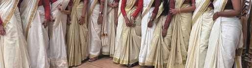 Students and faculty in Kasavu sarees