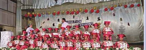 Kindergarten graduates on decorated stage
