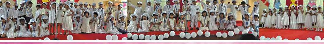 Children on stage with roses and balloons