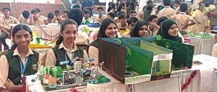 Students exhibiting environmental model stall